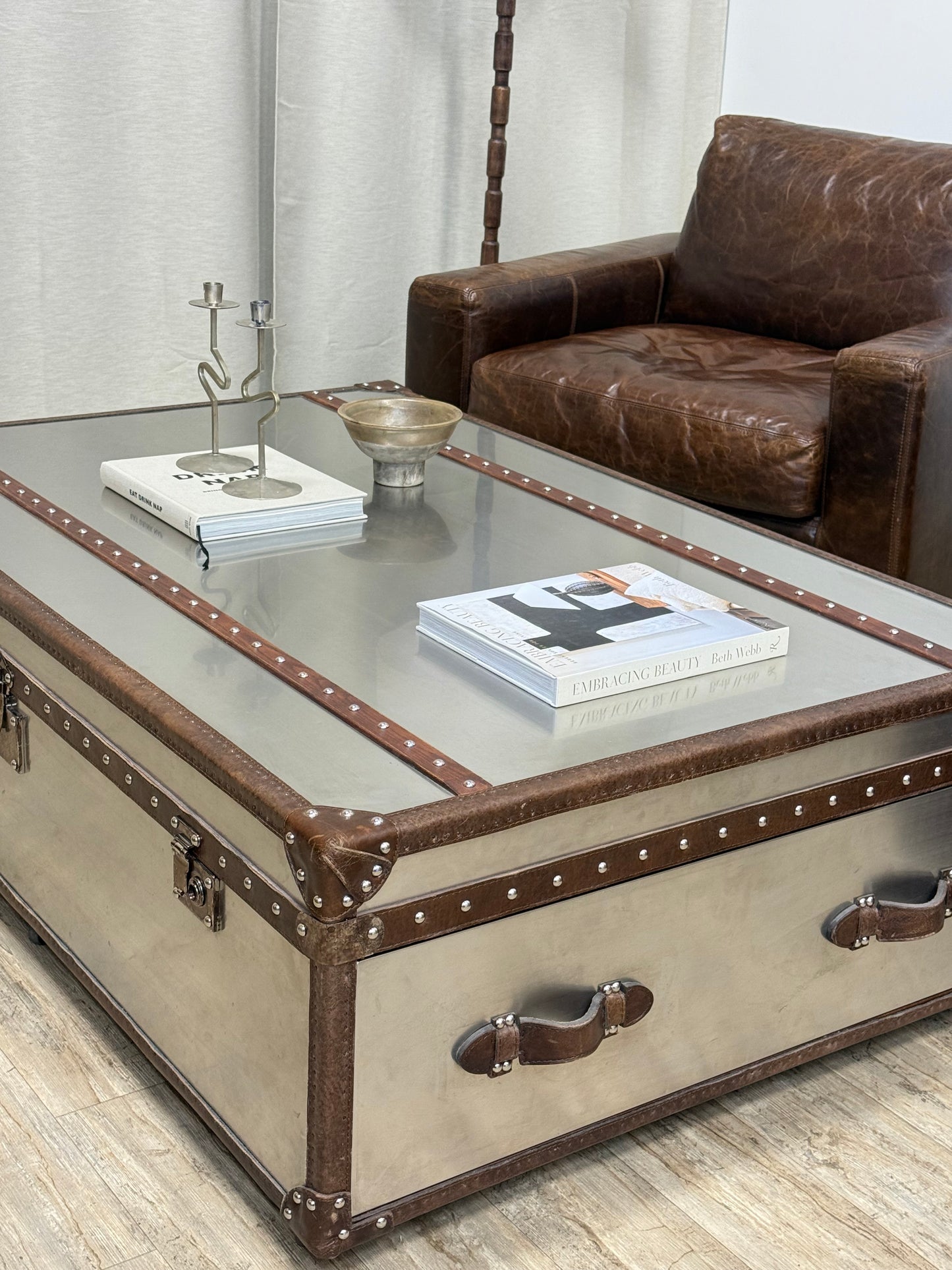 Aviator Style Trunk Coffee table staged and Maxweel leather armchairs 